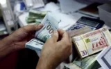 تدخل في دائرة الربا.. تحذيرات من شراء الدولار عبر بطاقة الأغراض الشخصية